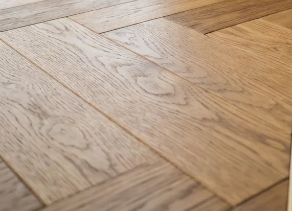 Close view of natural oak herringbone parquet